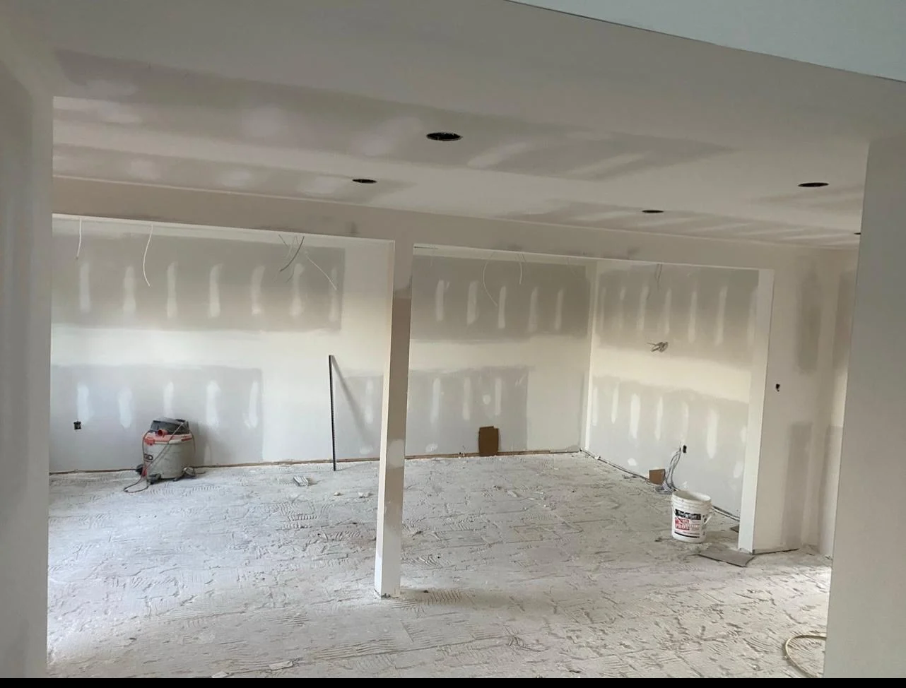 Basement multi-room layout with taped and mudded drywall seams