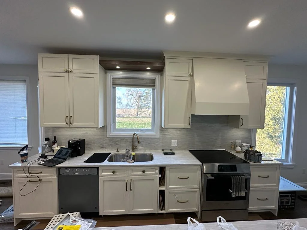 Finished kitchen with tile backsplash and freshly painted walls