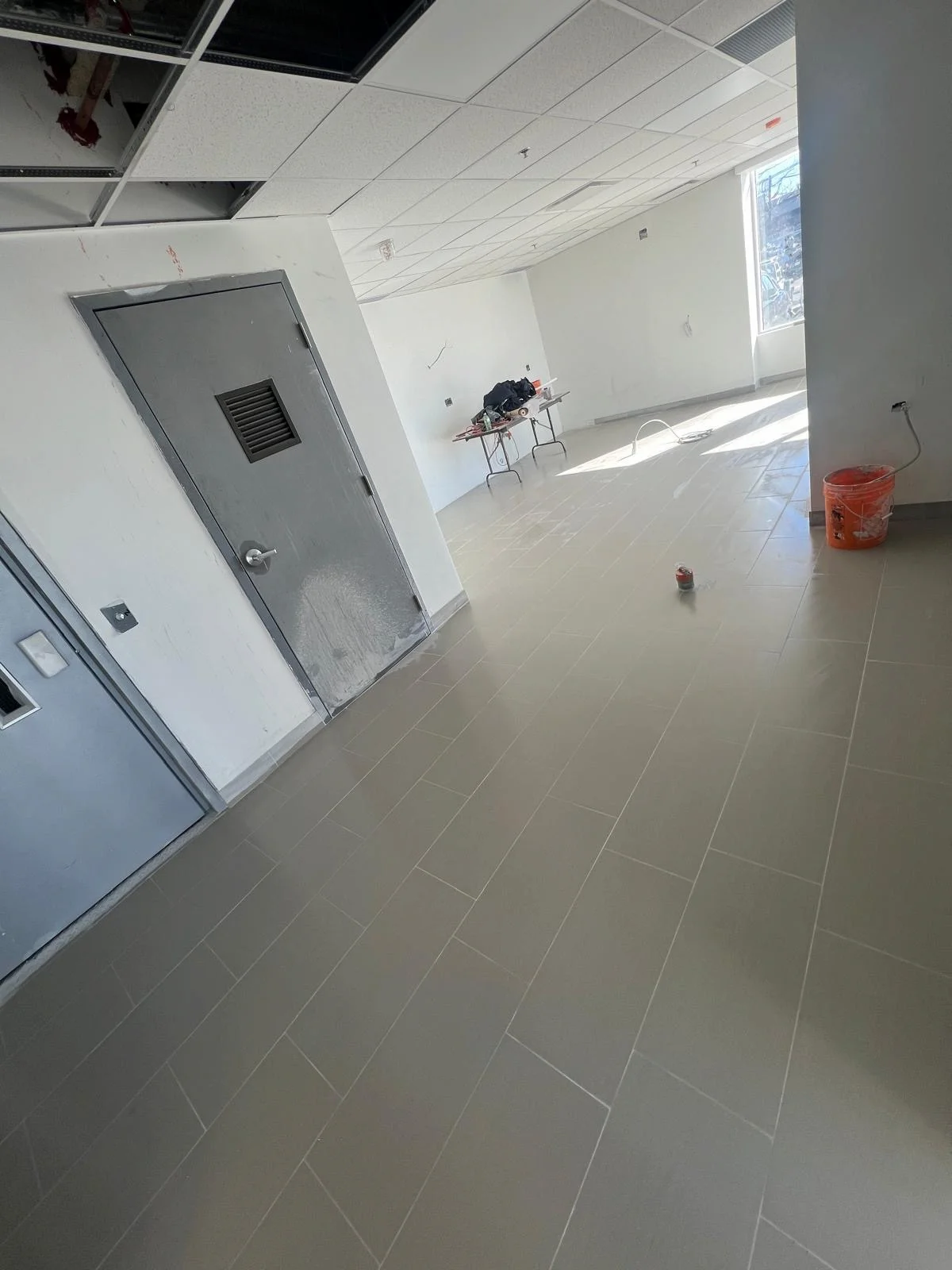 Finished commercial space floor tile installation