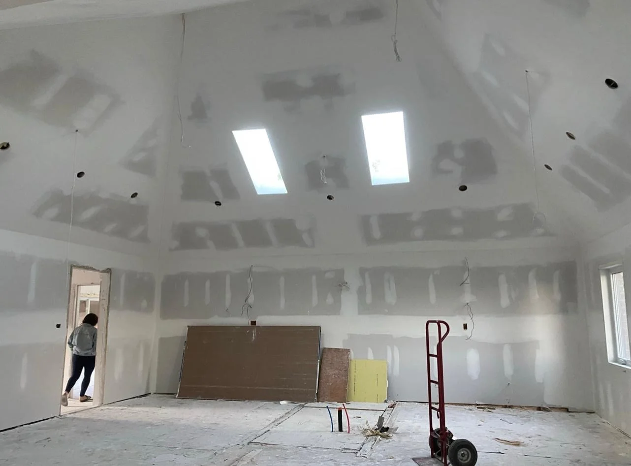 Vaulted ceiling with visible taped drywall seams mid-finish, Scarborough home